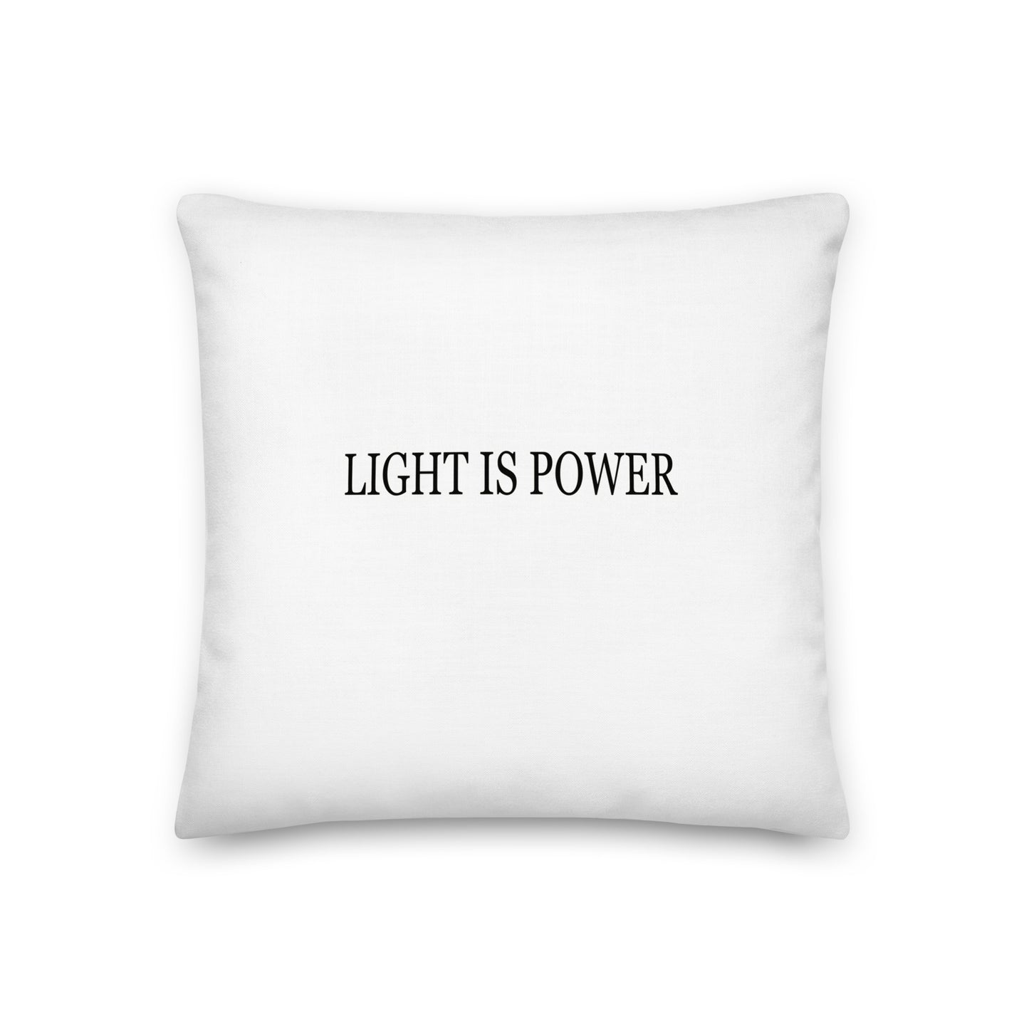 White pillow with 'LIGHT IS POWER' text on a white background