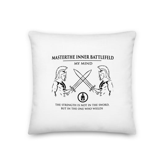 White pillow with black design and text on a white background