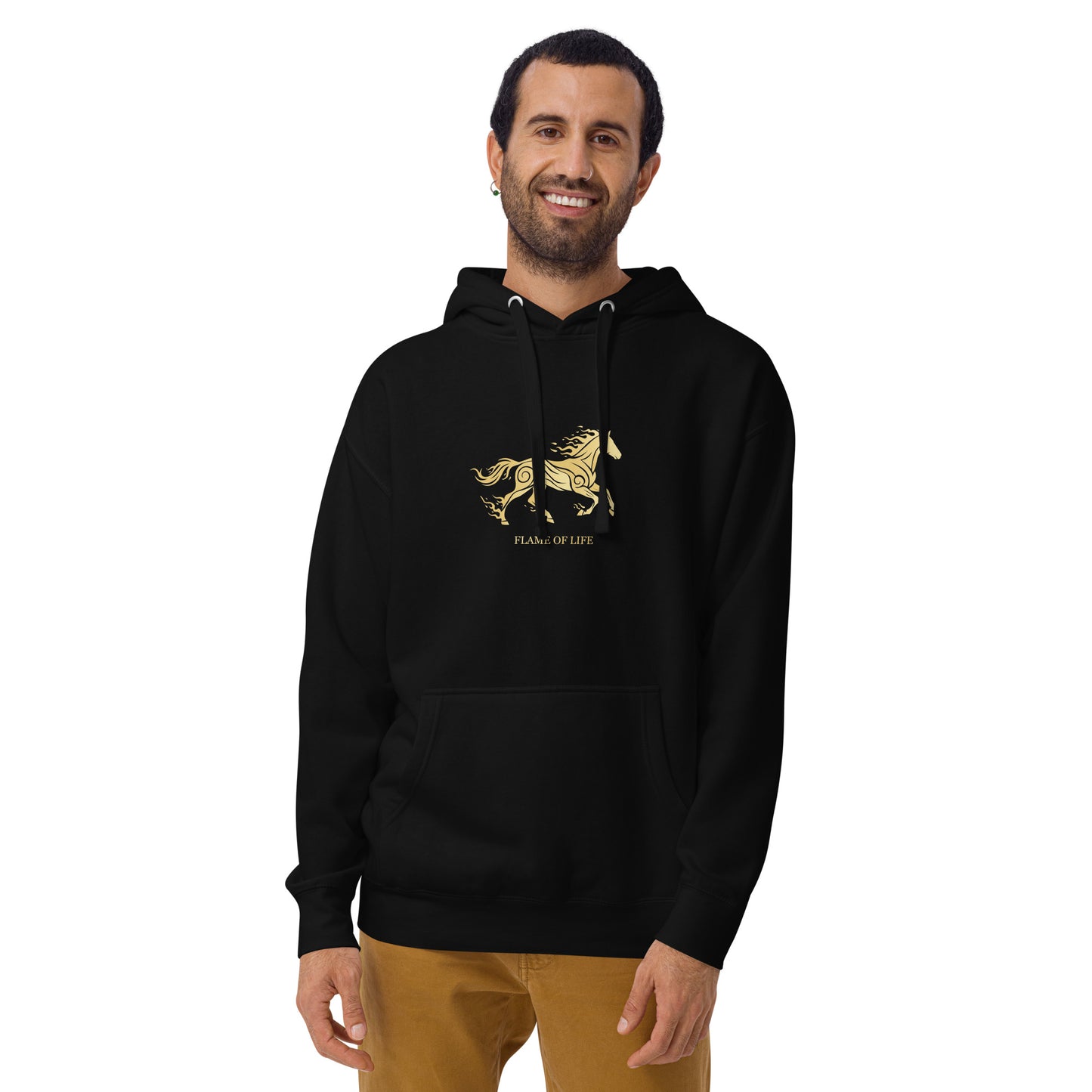 Man wearing a black hoodie with a a gold horse Flame of life design by the vision 2026.A symbol of inner fire, strength, and the spirit refuses to be tamed by the system.