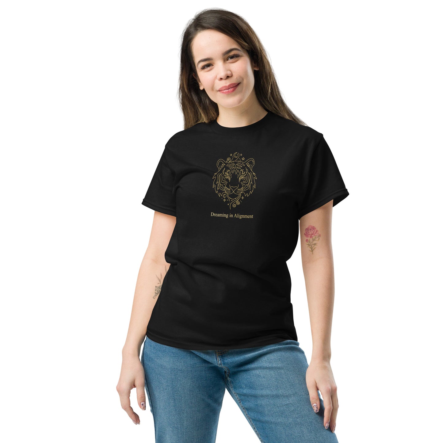 Woman wearing a black t-shirt with Artistic graphic of a gentle tiger with the text "Dreaming in Alignment," symbolizing the overcoming of fear, creative freedom, and spiritual harmony.