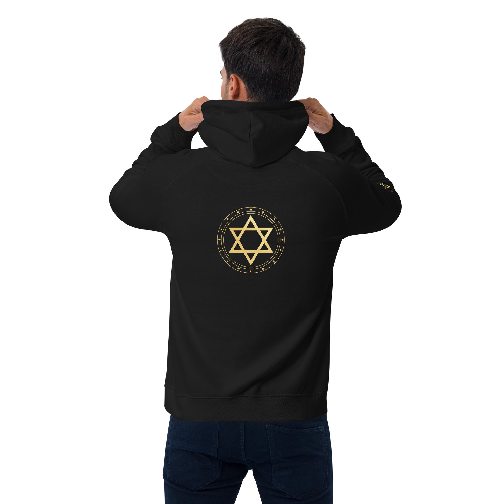 Person wearing a black hoodie with a gold star protection of David symbol on the back against a white background