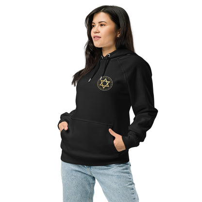 Person wearing a black hoodie with a gold emblem on a white background